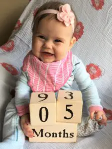 Ellie with 5 mo blocks