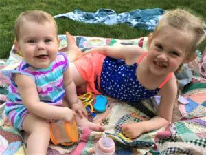 Girls on a blanket outside