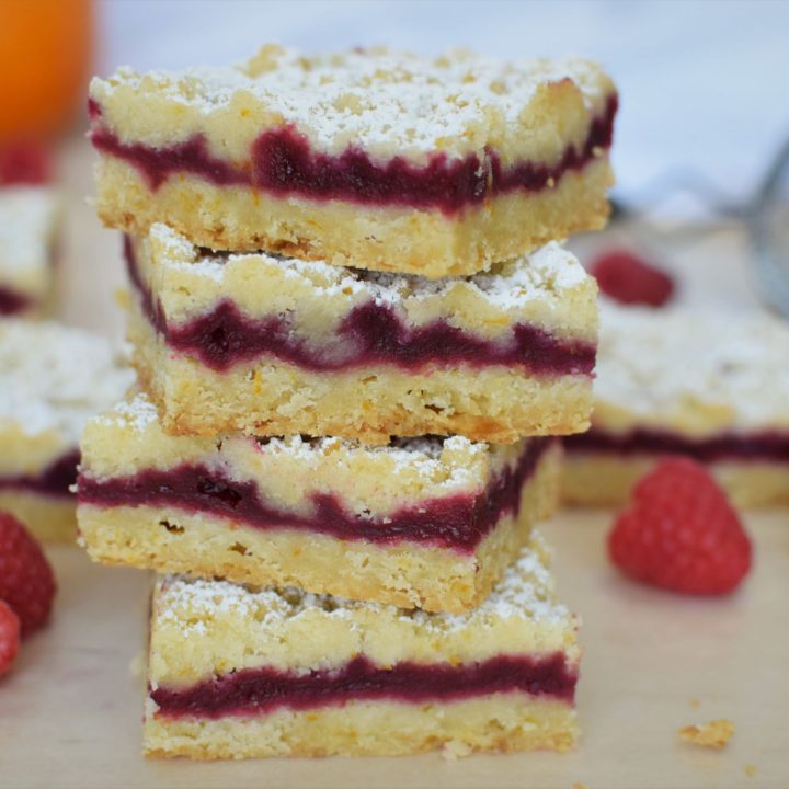 stack of four raspberry orange shortbread bars. this bread will rise