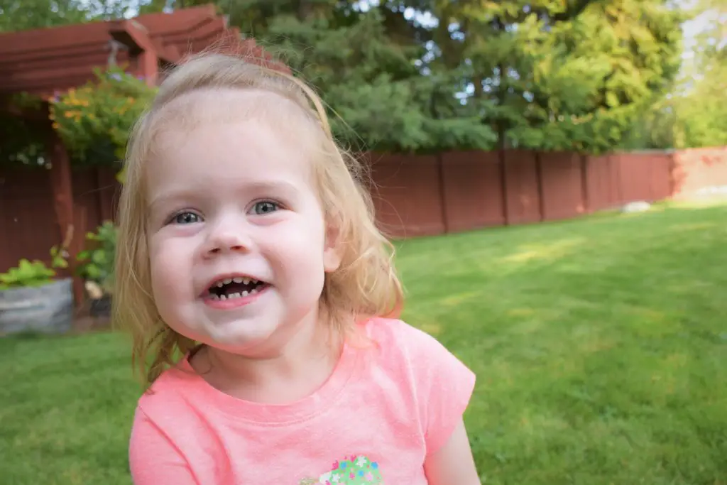 Ellie cheesing it up on 2nd birthday.