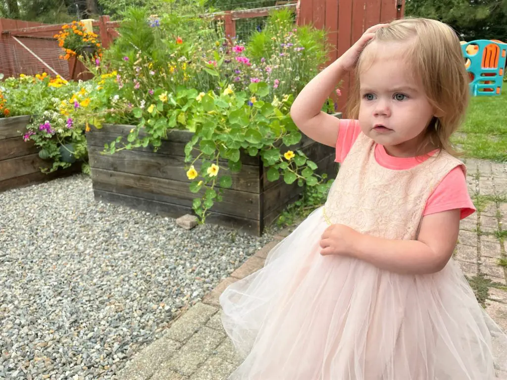 Squash Presentation Ellie in dress in garden