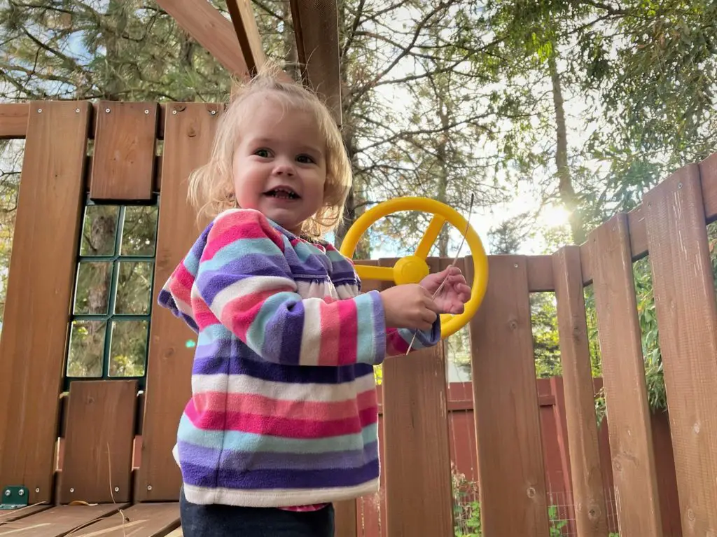 Ellie playing on playset