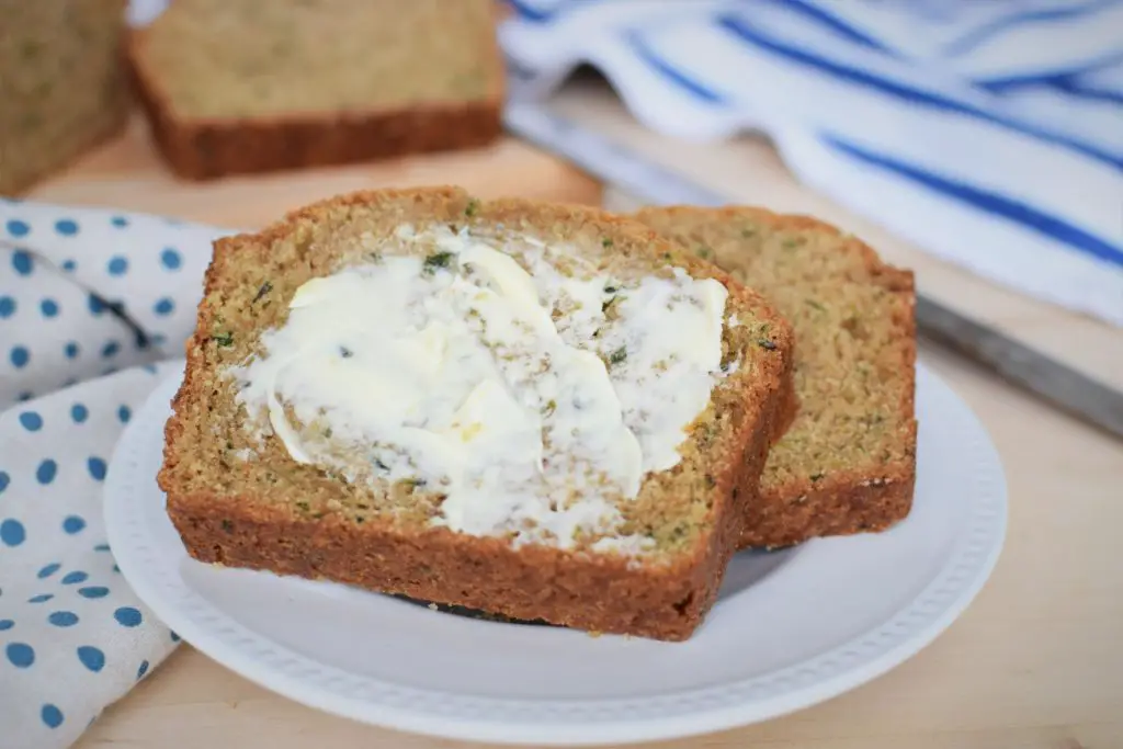 Buttered slice of zucchini bread