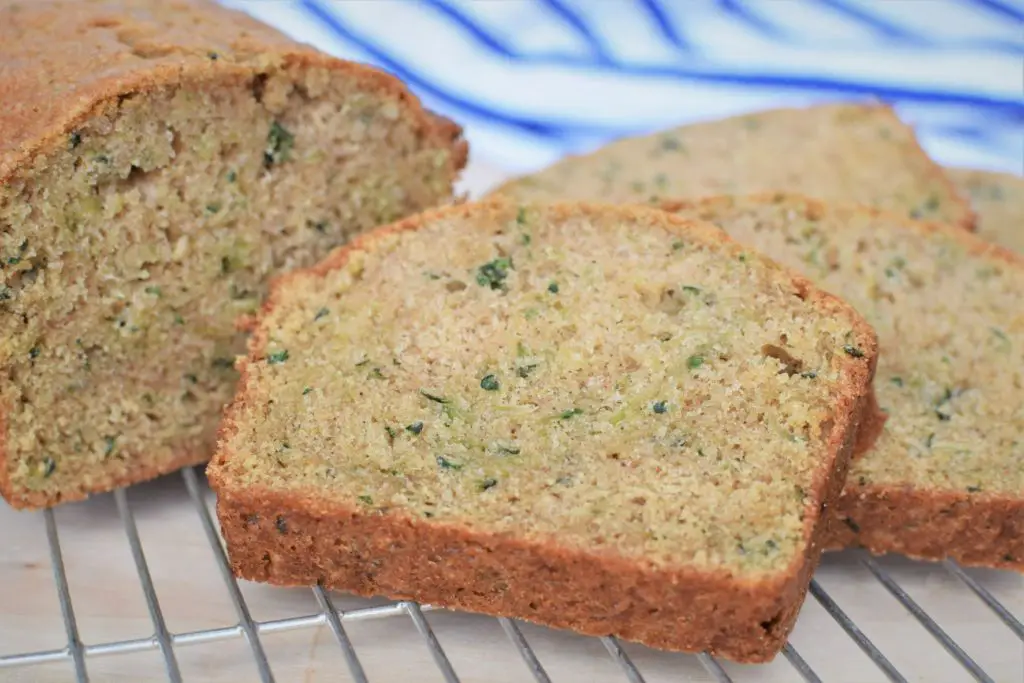 sliced zucchini bread loaf on cooling rack