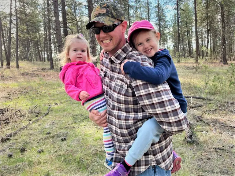 Dad holding both girls -this bread will rise