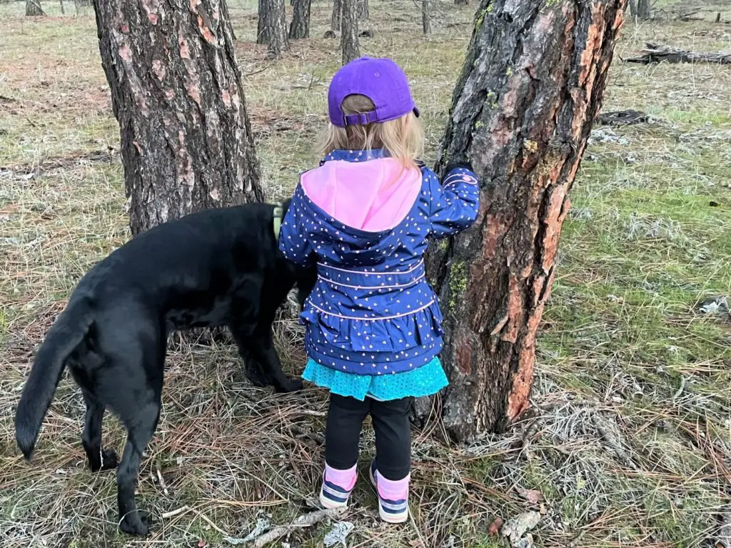 girl adventuring with dog