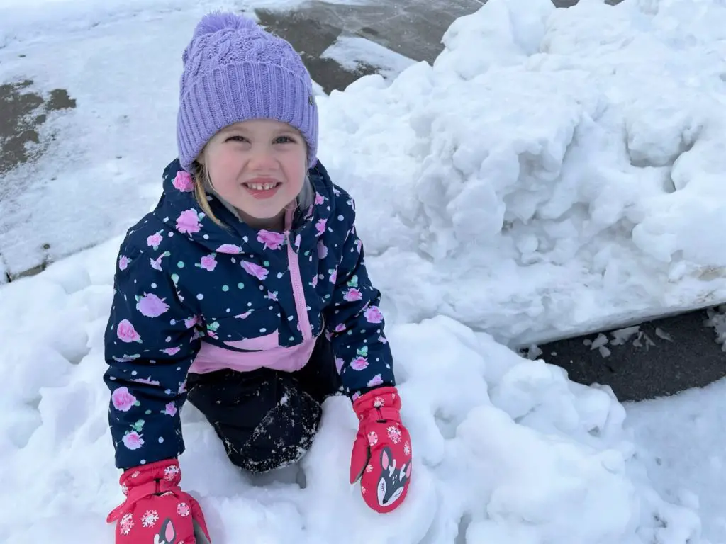 girl on a snow bank - this bread will rise