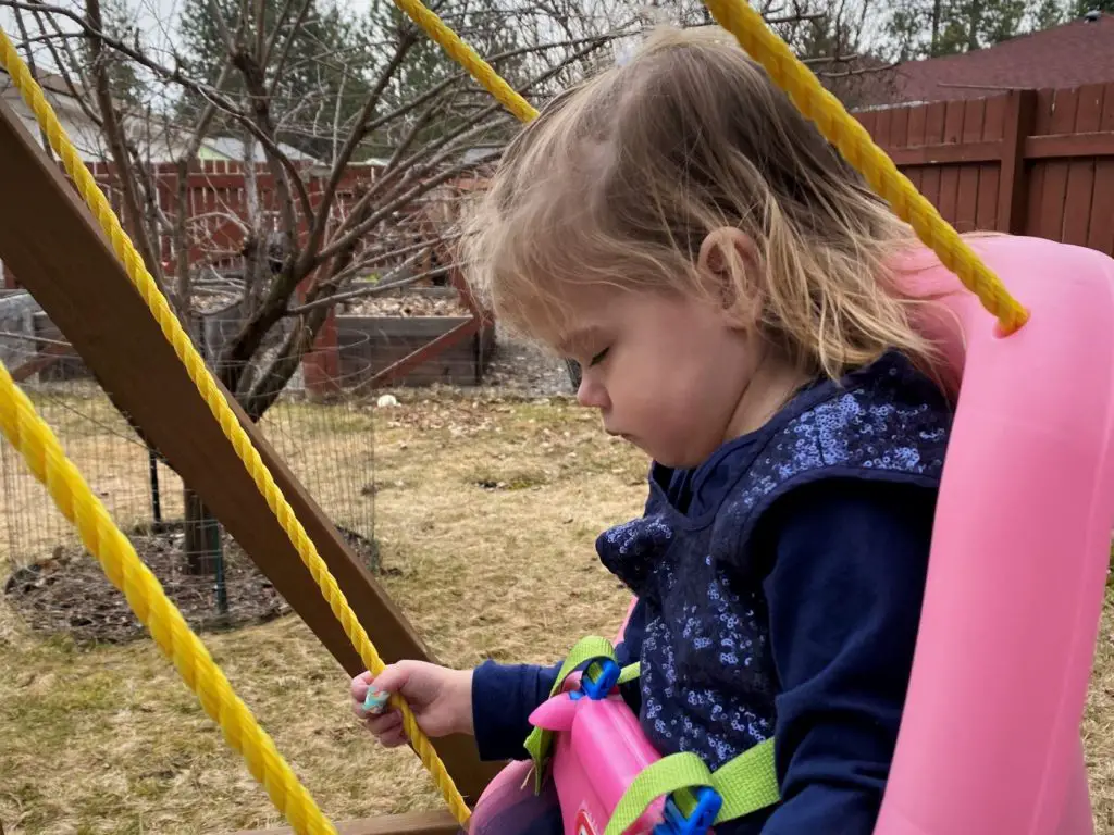 sleeping girl in swing