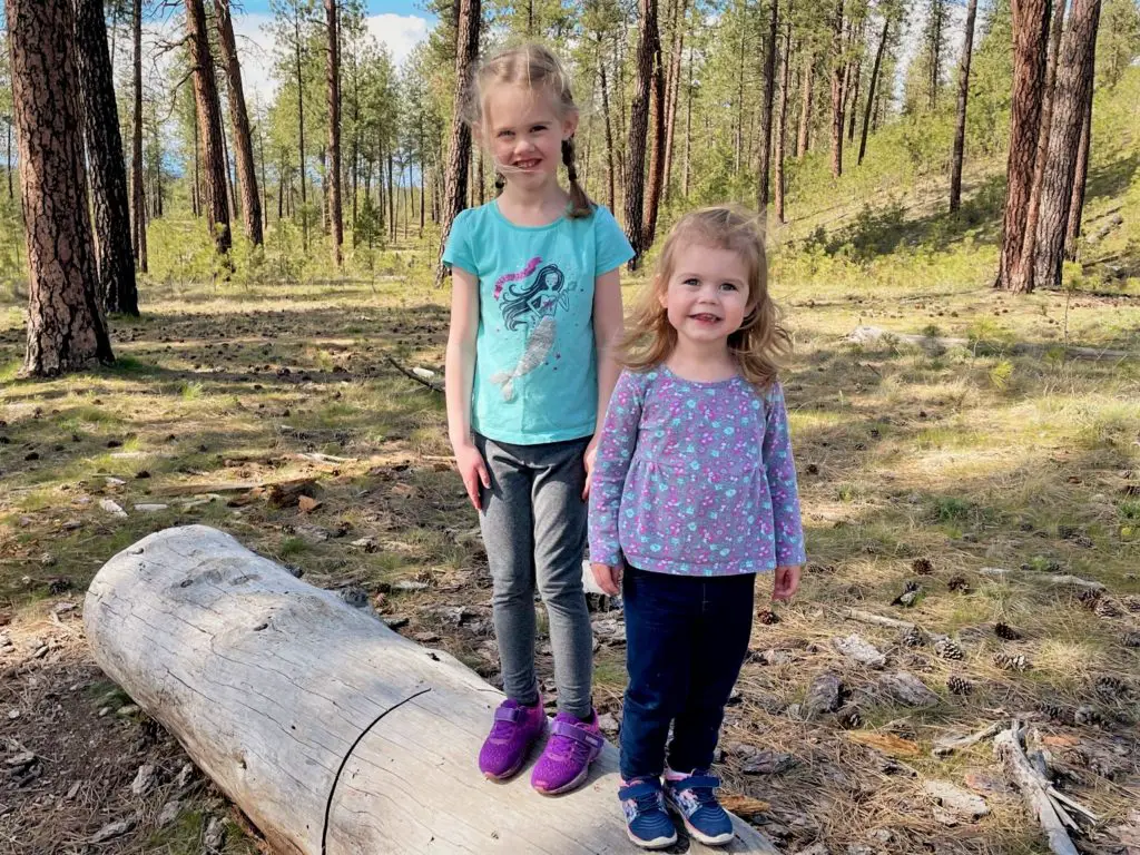 Girls standing on a log - this bread will rise