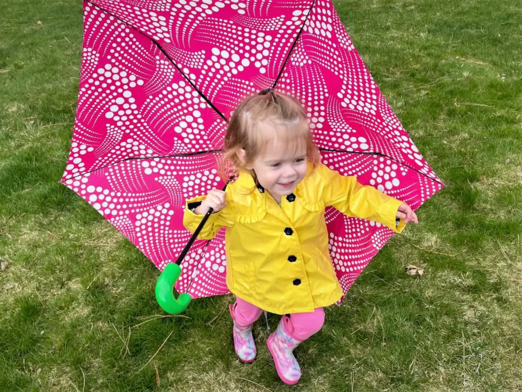 Young girl running with umbrella - this bread will rise