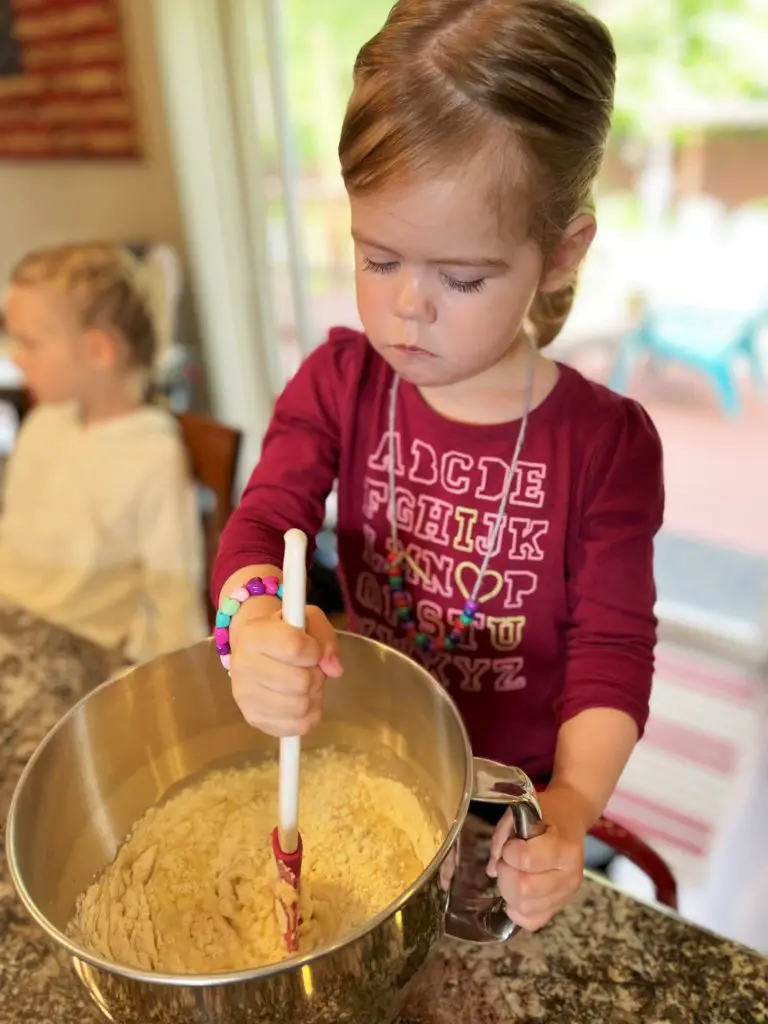 Girl stirring batter - this bread will rise