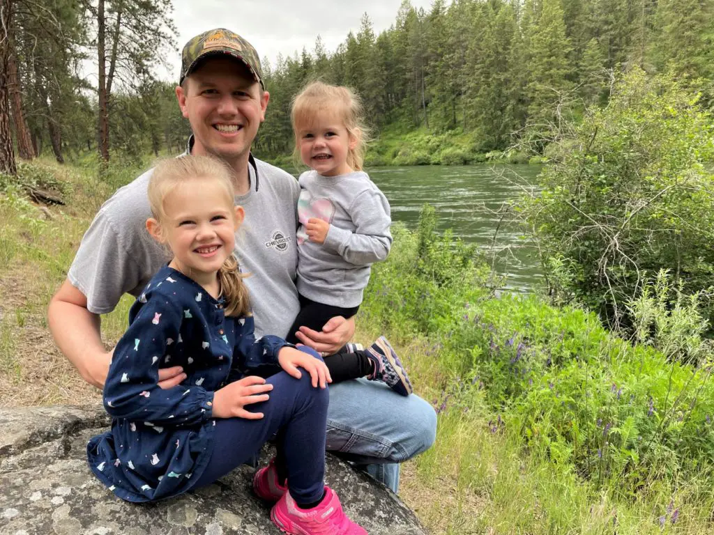 Dad with two girls next to the river - this bread will rise