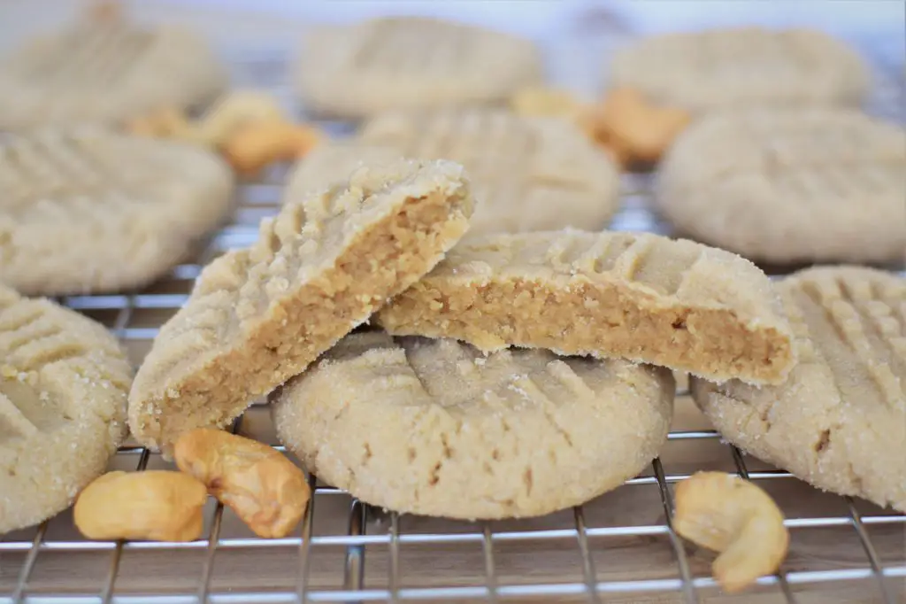 Cookie split in halt on top of another cookie on a cooling rack - this bread will rise