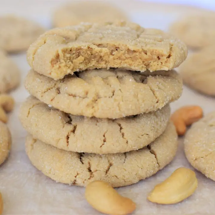 Stack of cashew butter cookies, top cookie has a bite out of it - this bread will rise