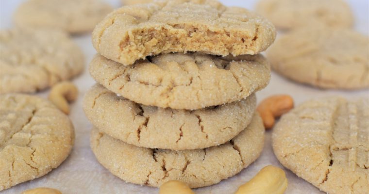 Stack of cashew butter cookies, top cookie has a bite out of it - this bread will rise