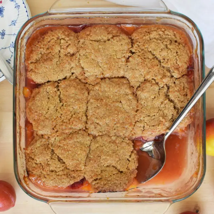 Plum cobbler with a serving removed - this bread will rise