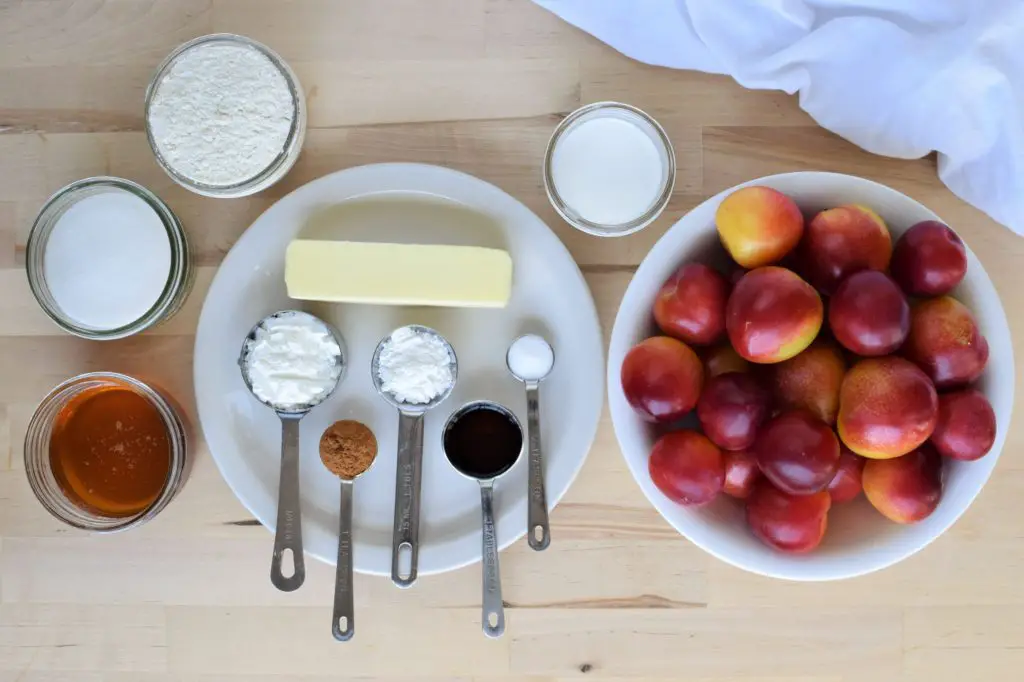 Ingredients laid out for honeyed plum cobbler.