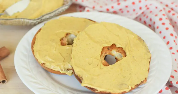 Pumpkin cream cheese spread on toasted bagels