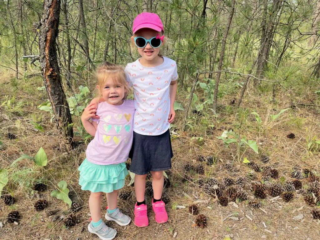 Two sisters hugging on a trail in the woods - this bread will rise