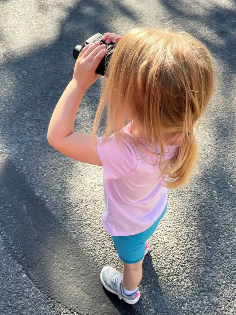 Girl looking through binoculars - this bread will rise