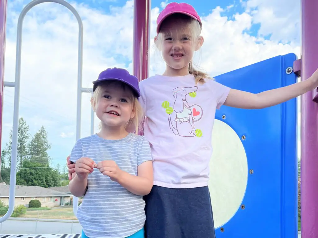 Two girls on playground equipment - this bread will rise