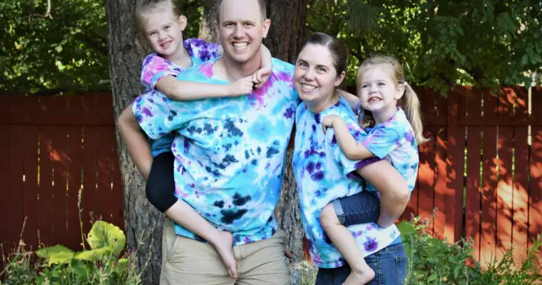 Kids on piggy back on mom and dad in matching tie-dye shirts - this bread will rise