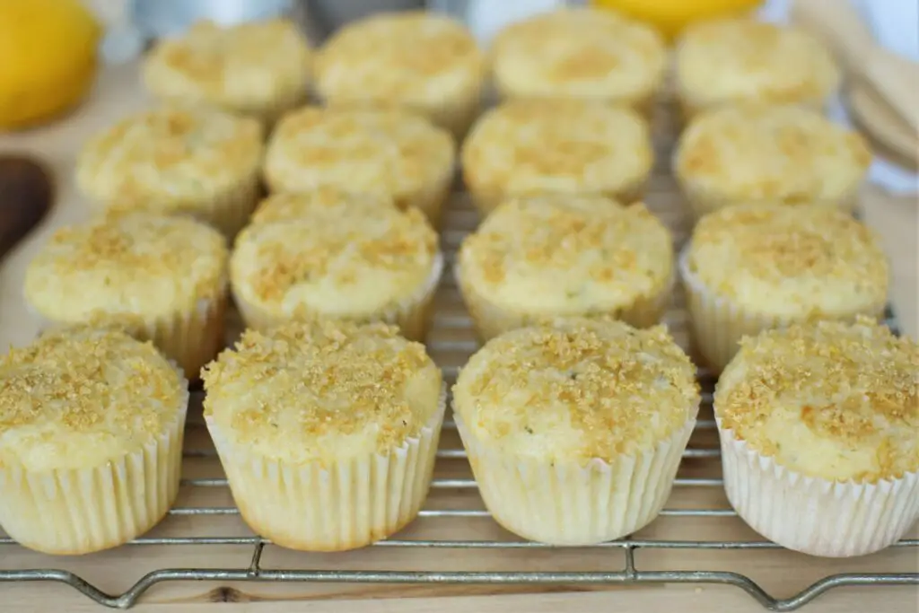 Lemon zucchini muffins on a cooling rack - this bread will rise