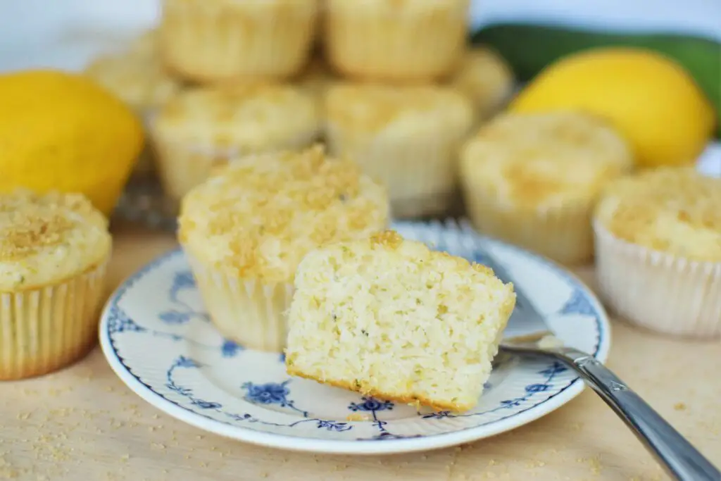 Cut lemon zucchini muffin on plate - this bread will rise
