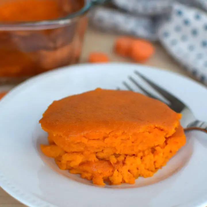 Scoop of carrot souffle on a plate - this bread will rise