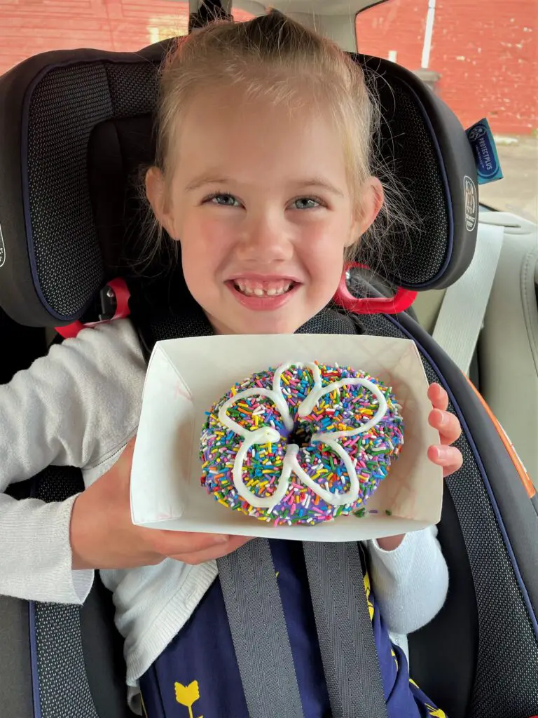Rosie with a sprinkle covered doughnut - this bread will rise