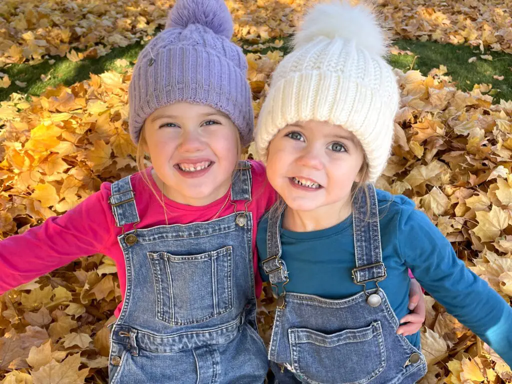 Girls hugging in overalls - this bread will rise