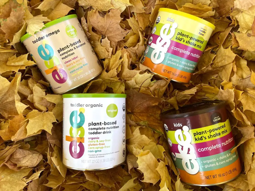 Four cans of Else Nutrition products laying in leaves