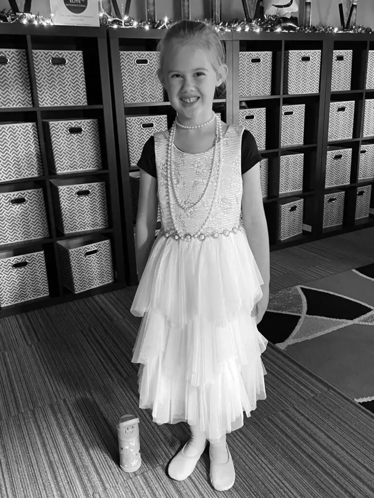 Rosie in princess dress and necklaces with ballet shoes - this bread will rise